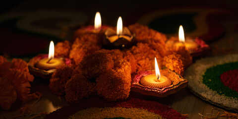 Diwali Lights. Beautiful arrangement of oil lamps and marigold flowers for celebration.