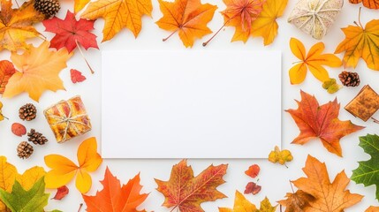 Autumnal arrangement with colorful leaves and gifts on a white background