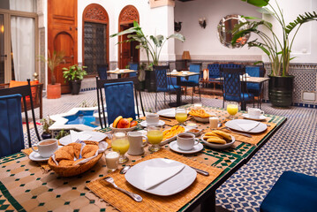 Traditional breakfast in Morocco with oranges and arabic bread