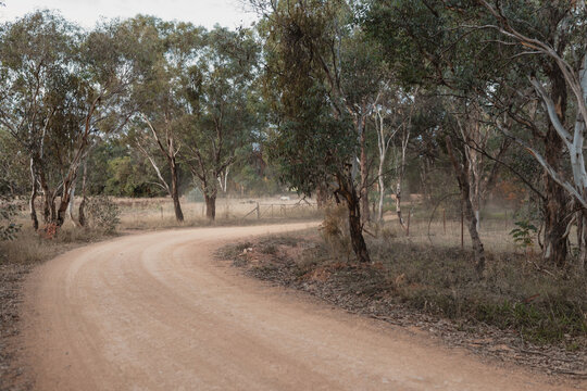 Sharp bend in dusty dirt road in rural Australia
