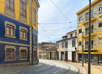 Obraz premium Oporto building facades in historic city street. Traditional colourful houses with tile decoration,