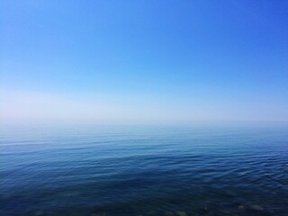 Fototapeta premium Calm and Serene Ocean with Clear Blue Sky