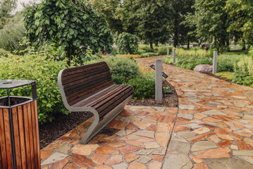 A beautifully paved stone path winding through a lush garden, perfect for leisurely strolls in a tranquil outdoor setting