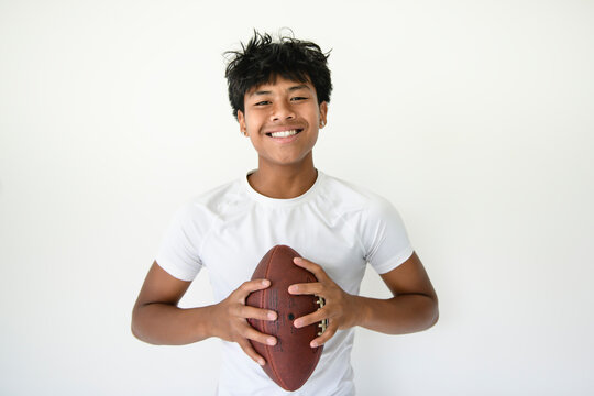 one Thai teenager boy play american football players isolated on white background