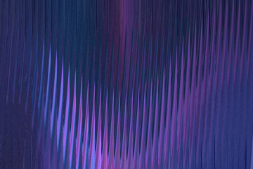 Abstract vertical lines of deep blue and vibrant purple create a textured, futuristic, and energetic background pattern
