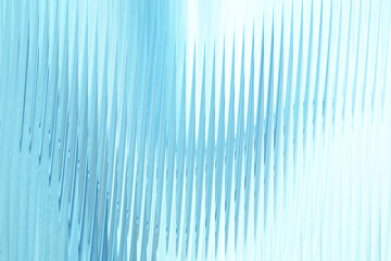 Abstract blue and white textured background with vertical wavy lines creating a sense of movement...