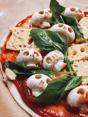 Making homemade pizza for Halloween. High quality photo