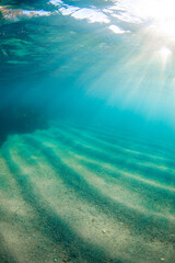 Underwater view of ocean sand bottom.