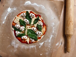 Making homemade pizza for Halloween. High quality photo