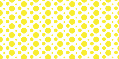 Colorful retro polka dot seamless vector pattern with yellow and orange circles on a vintage-style backdrop