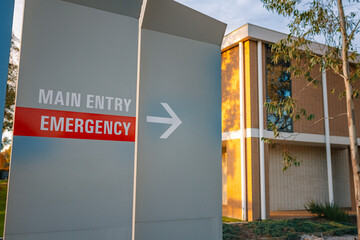 Signage leading to hospital emergency department entrance