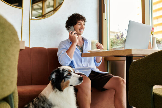 Joyful moments of a young man enjoying a cafe visit with his dog