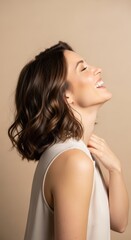 Naklejka premium A beautiful woman with short brown hair laughs with her head tilted back and eyes closed, conveying joy and happiness