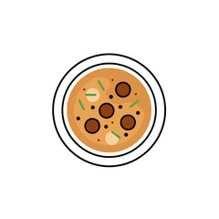 A bowl of creamy soup with meatballs.