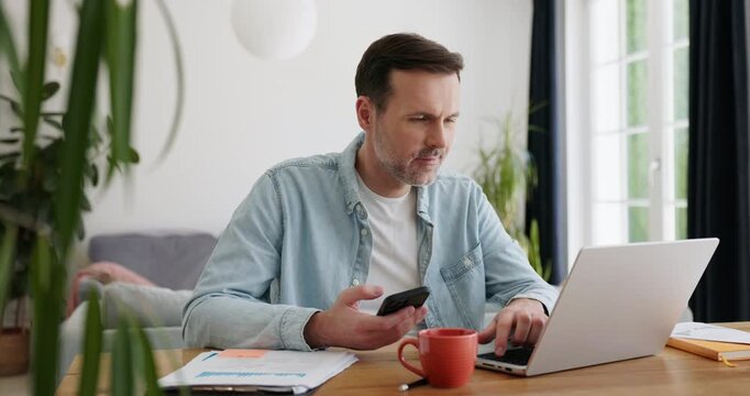 Video of man at home using mobile phone for online authentication