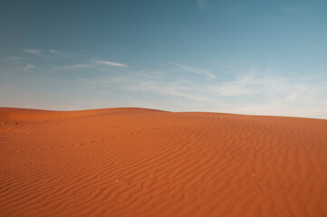 Natural designs and shapes in the sand, caused by the wind.