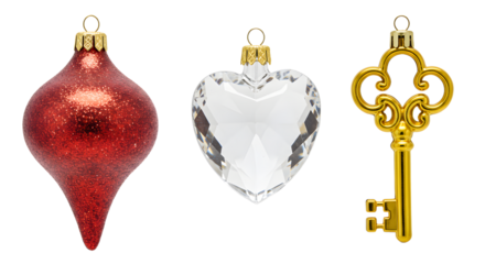Red glitter Christmas ornament, clear heart-shaped ornament, and vintage gold key isolated on white, perfect for holiday decoration and festive themes