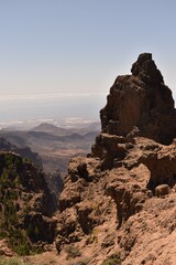 Rock formations in a rugged mountainous area. Natural stone landscape shaped by erosion and time.
