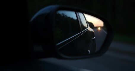 Blind spot monitoring icon on the mirror of a modern car. High quality 4k footage
