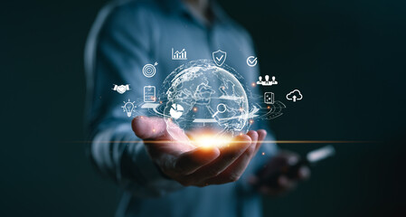 Businessman holding digital globe with technology icons, concept of global internet connection, fintech innovation, cloud computing, data analytics, and digital marketing solutions, Big data.