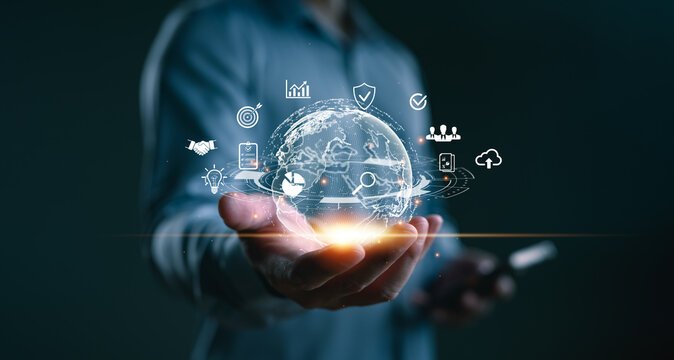 Businessman holding digital globe with technology icons, concept of global internet connection, fintech innovation, cloud computing, data analytics, and digital marketing solutions, Big data.