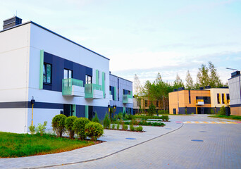 Townhouses in gated community. Norwegian Apartment Block. Scandinavian Town House. Two-story Modern Residential Home building in Scenic District. Housing in Norway. Modern Urban House in forest.