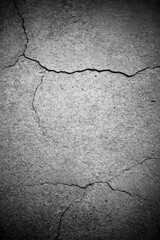 Cracked Concrete Surface with Detailed Texture and Dark Tones