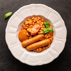 Cassoulet beans with meat and sausage french cuisine vegetables dish natural product tasty snack fresh delicious gourmet food background on the table rustic top view copy space