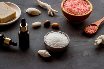 Essential oil in bottles and spa cosmetics, close up. Beauty spa therapy cosmetics and wellness background