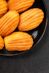 Madeleine cookies sweet dessert traditional french sweets tasty snack fresh delicious gourmet food background on the table rustic top view copy space