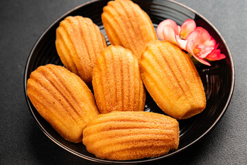 Madeleine cookies sweet dessert traditional french sweets tasty snack fresh delicious gourmet food background on the table rustic top view copy space
