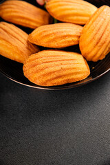 Madeleine cookies sweet dessert traditional french sweets tasty snack fresh delicious gourmet food background on the table rustic top view copy space