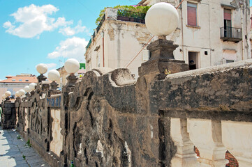 Ancient baroque balustrade of piperno stone in Via Bartolomeo Capasso Ave. overlooking Via San Severino below in Naples, Italy. Remains of a portico of 1737 for the church of Santi Severino and Sossio