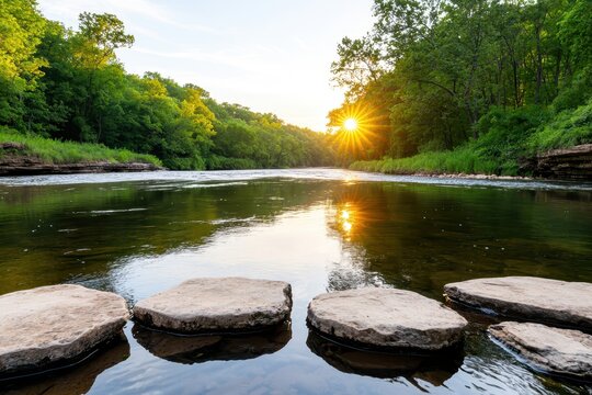 A serene river scene at sunset, featuring stepping stones in the foreground and lush greenery along the banks, reflecting warm golden hues on the water.