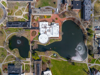 Wheaton College top view on Peacock Pond and Chase Dining Hall in historic town center of Norton, Bristol County, Massachusetts MA, USA. 