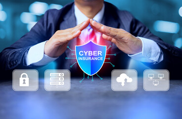 Cyber ​​Insurance concept with businessman hand protected organization from cyber threats, helping to reduce the impact as well as covering the financial costs of the organization