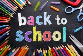 Chalkboard message "back to school" surrounded by colorful art supplies pencils, crayons, markers, scissors, against a dark background
