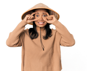 Young Filipina with Vietnamese hat keeping eyes opened to find a success opportunity.