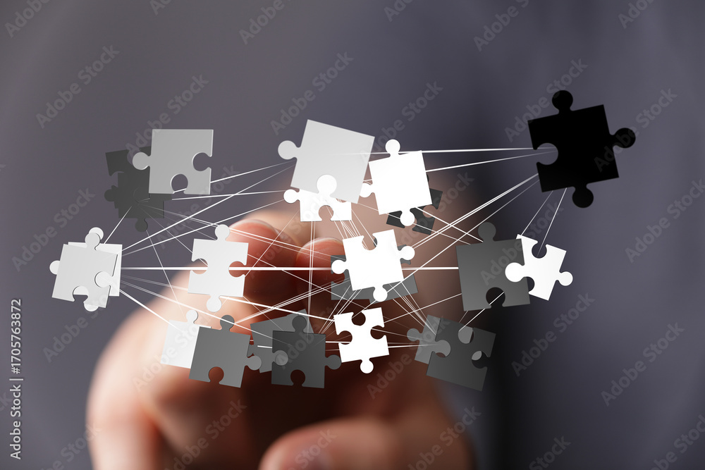 Poster teamwork, strategy, and problem-solving. visual of interconnected puzzle pieces.