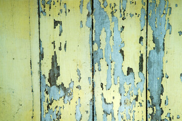 Weathered Yellow and Blue Wooden Planks with Peeling Paint Texture