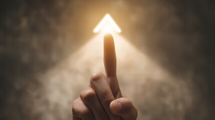 A person's left hand points upwards with a glowing index finger against a textured background...