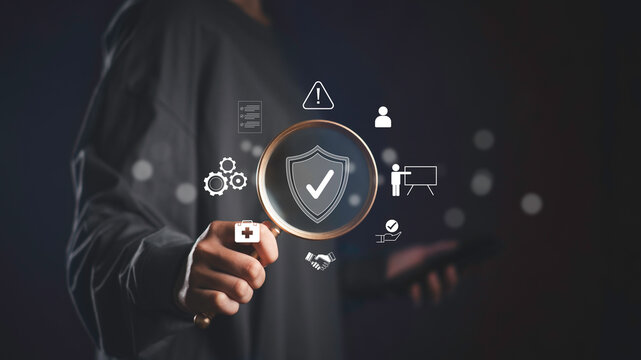 Businessman analyzing work safety compliance with digital icons representing risk management, health protocols, and quality assurance in a secure workplace environment.