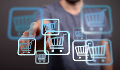 Image of a person interacting with digital shopping carts, representing online shopping and e-commerce.