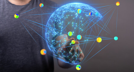 Person interacting with a digital globe, showcasing global network connections and data visualization.