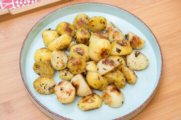 Navratri vrat food jeera aloo ki sabji that is ghee roasted cumin potato in blue plate. Hindu upvas or fasting item.