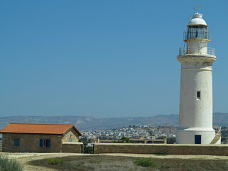 Old white lighthouse near Paphos city Cyprus