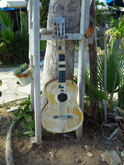 Art installation from an old brown guitar