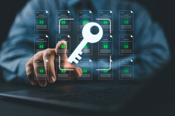 Encryption key management and secure document storage system. File data encryption and access control. A person using a laptop computer.