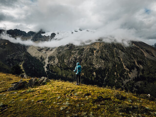 Backpacking woman hiking on mountain top