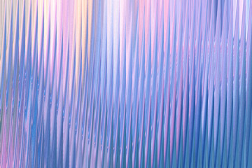 A shimmering, abstract background with vertical wavy lines in shades of pastel blue, pink, and yellow, creating a sense of gentle movement and ethereal beauty